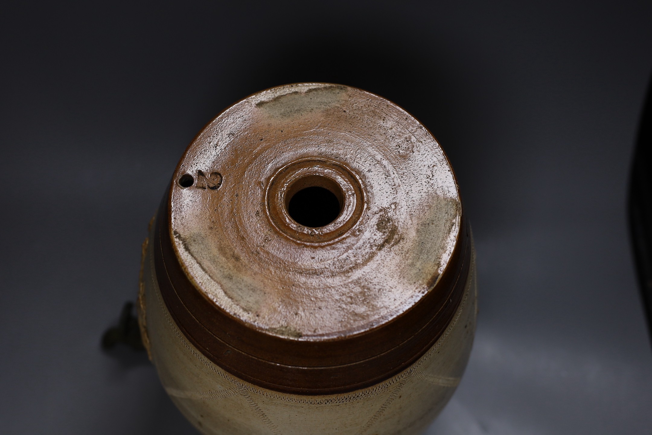A 19th century salt glazed stoneware Brandy barrel, with Royal coat of arms sprigging, 33cm
